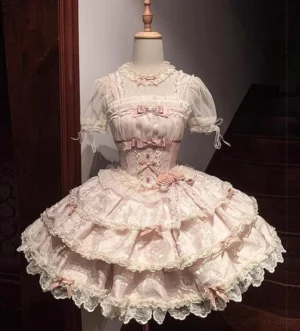 Pink ballet elegance sweet lolita JSK jumper skirt front view dress mannequin showcasing tiered ruffled skirt lace trim and satin bow bodice details