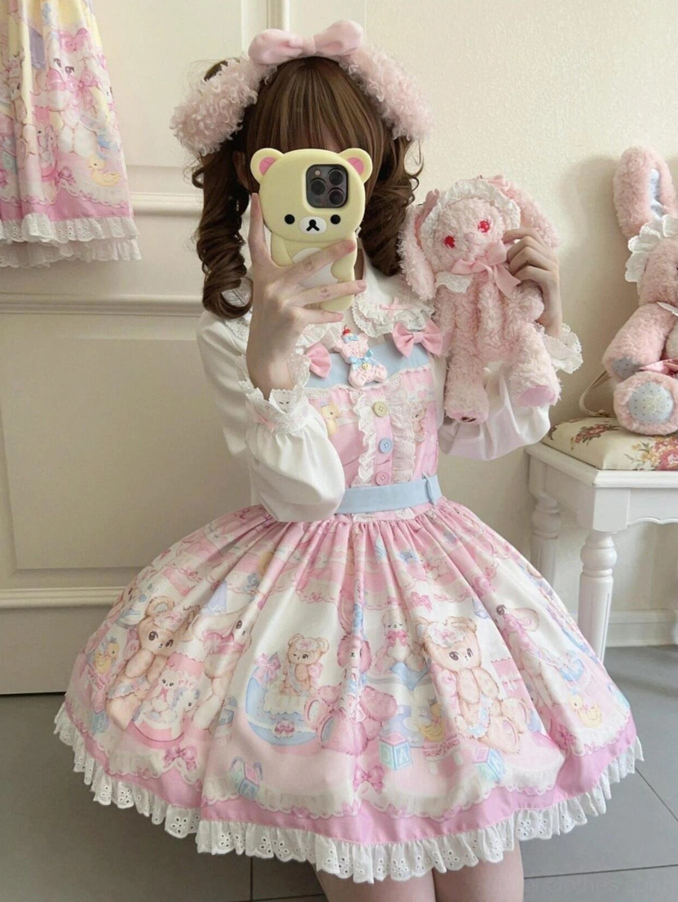 Pink sweet lolita salopette dress with bear and rabbit prints front mirror selfie view with fluffy ear headband