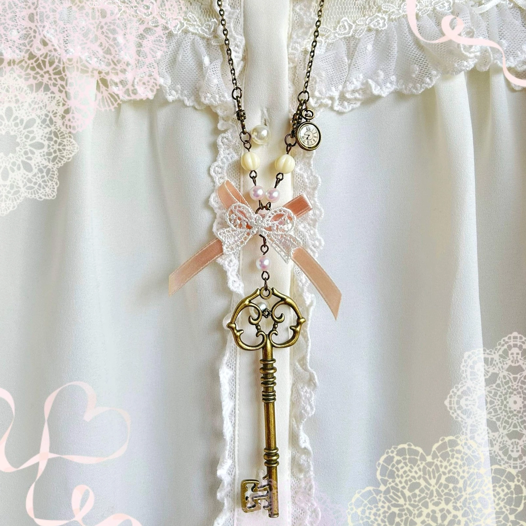 Pink bow key Lolita necklace sweater chain with rose-tinted key pendant and pearl accents for sweet Lolita coordinates and themed fashion styling