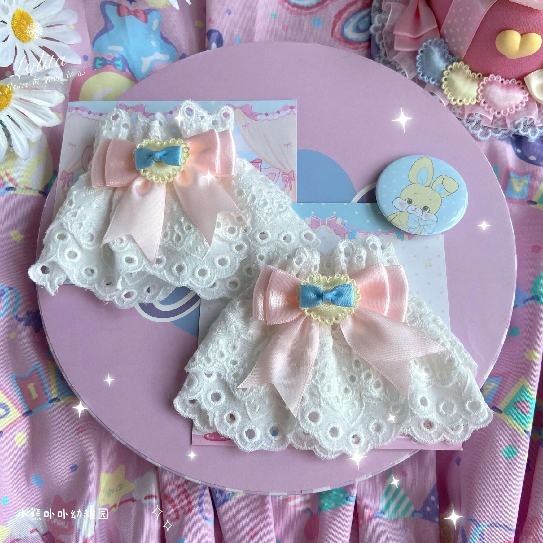 soft pink satin bow lace wrist cuffs with blue heart accents white eyelet lace base romantic styling