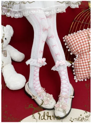 Pink festive bow lolita pantyhose with white lace calf trim and pink cross-strap design paired with white lolita skirt and pink mary jane shoes