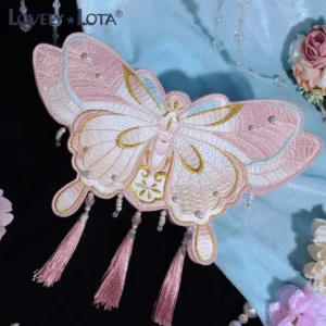 Pink and cream gradient Qi Lolita butterfly handbag featuring golden border embroidery and pearl decorations with pink tassels flat lay