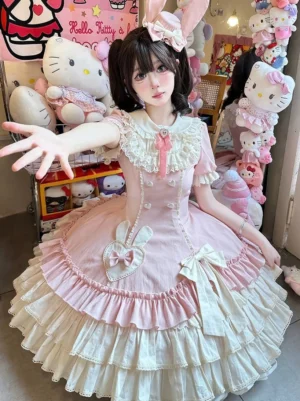 Pink creamy bunny heart vintage lolita op dress with lace-trimmed peter pan collar puff short sleeves and layered ruffled skirt in hello kitty themed shop setting