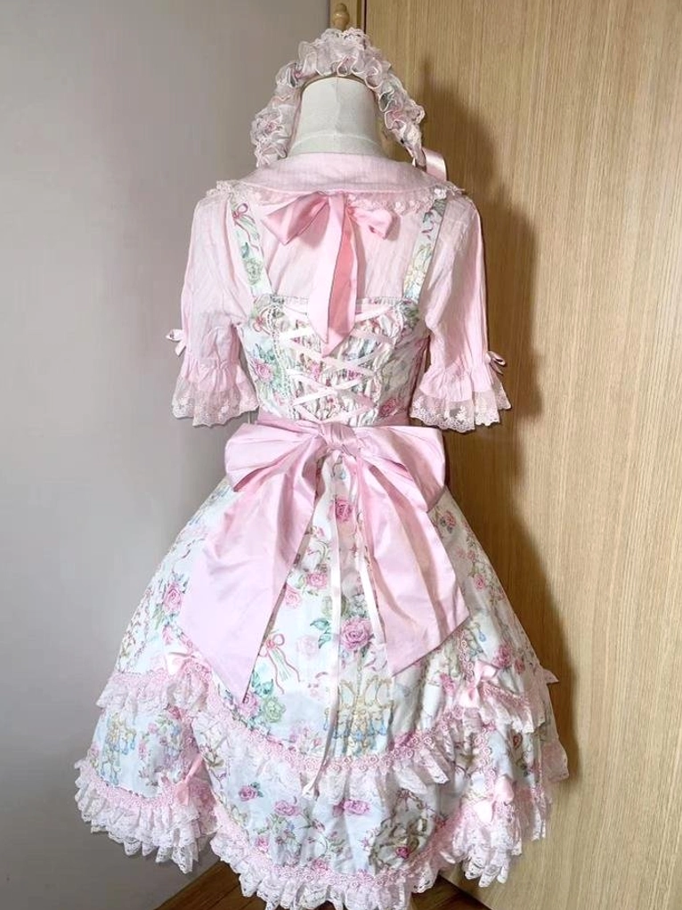 Pink floral old school Lolita JSK dress showing intricate jacquard weave and botanical print pattern in close-up detail