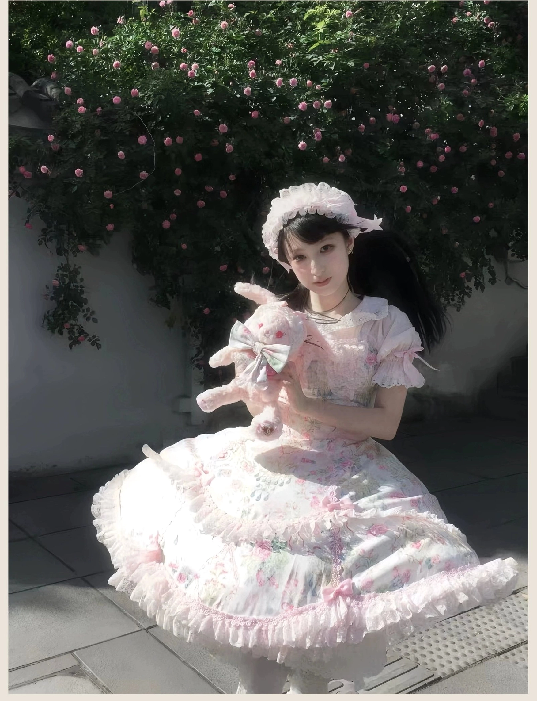 Pink floral Lolita JSK jumper skirt dress displayed on form showing side view silhouette and layered construction