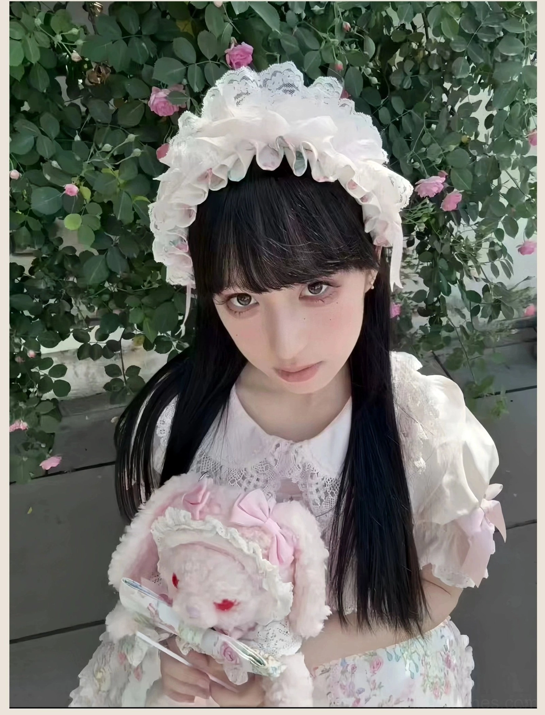 Pink floral Lolita JSK jumper skirt dress displayed with lace gloves and coordinating accessories for complete lolita look