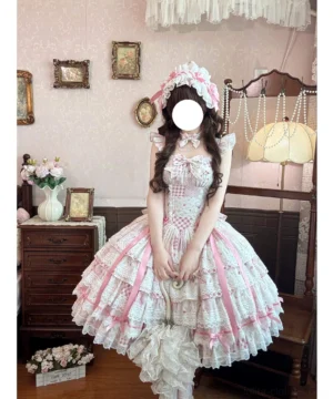 Front view of pink floral wedding lolita JSK dress with tiered ruffle hem, gingham bodice, and satin ribbon accents on female model wearing matching frilly hair accessory