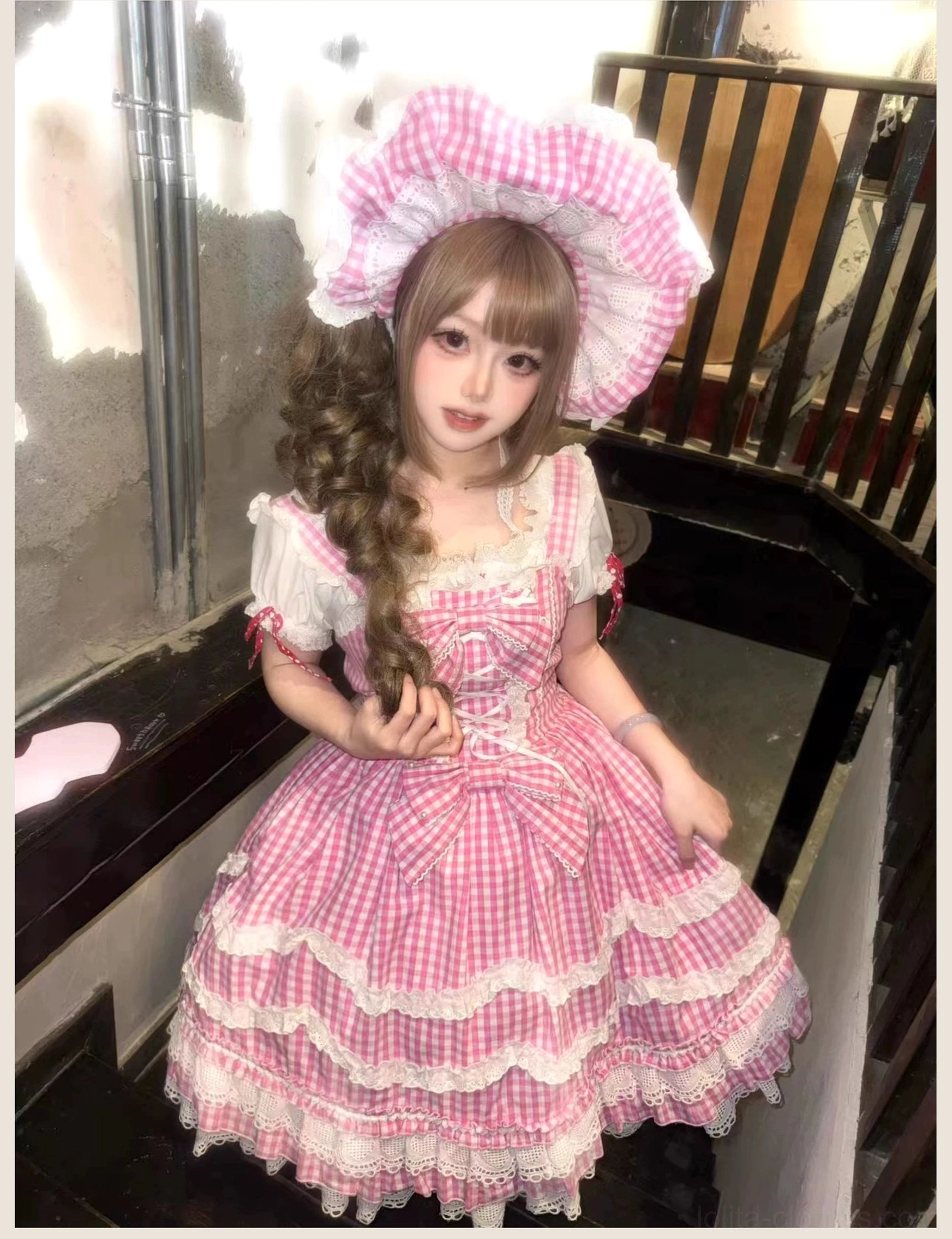 Vintage-inspired old school Lolita JSK dress in pink gingham, full-length side view highlighting proportions of corset bodice, tiered ruffle skirt, and petal trim detailing