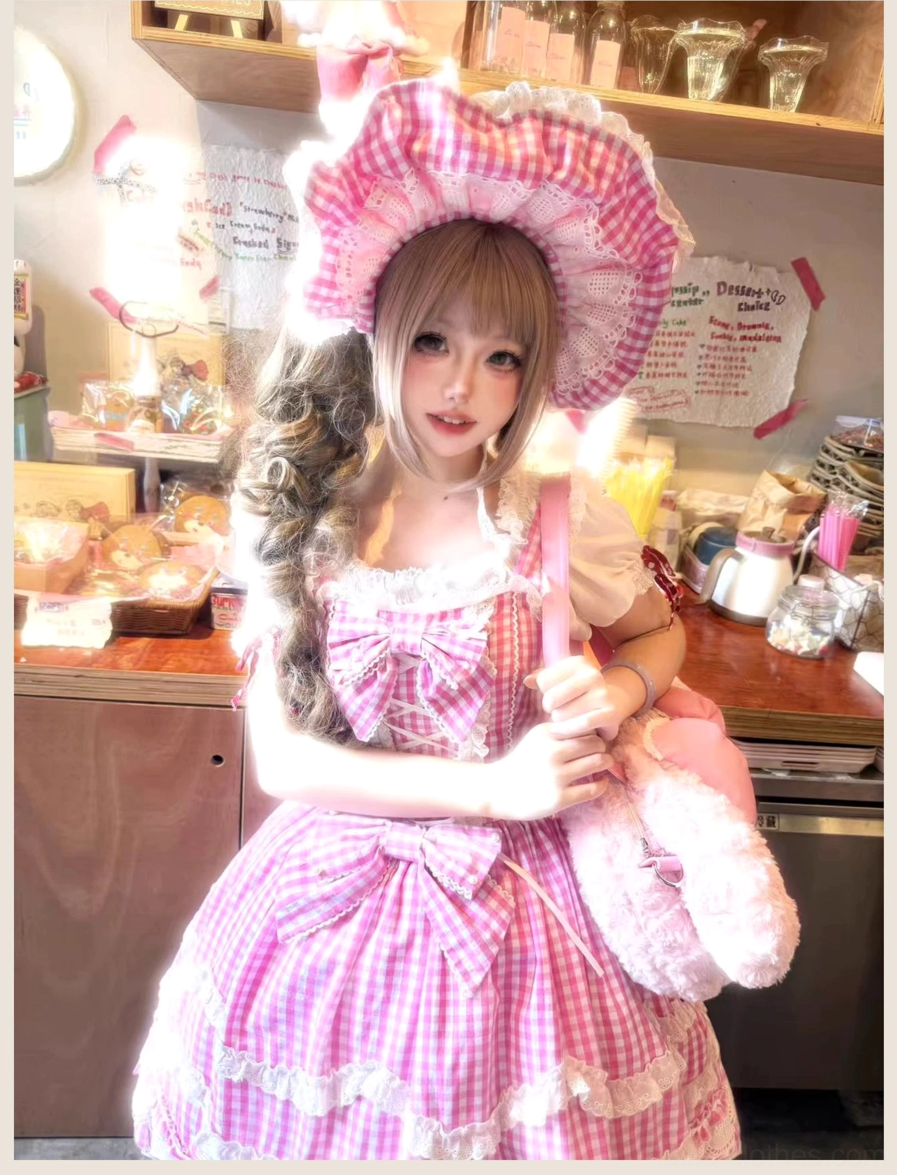 Vintage lolita jumper skirt dress in pink gingham pattern, detailed view of layered petal ruffles and white lace hem trim showcasing quality construction and old school aesthetics