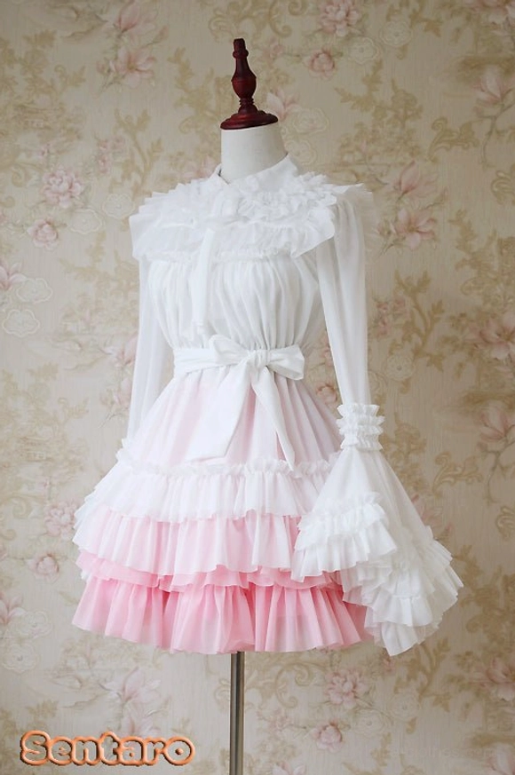 Pink gradient Lolita dress featuring white long-sleeve top with ruffled collar and cuffs, tiered layered hem and waist detail