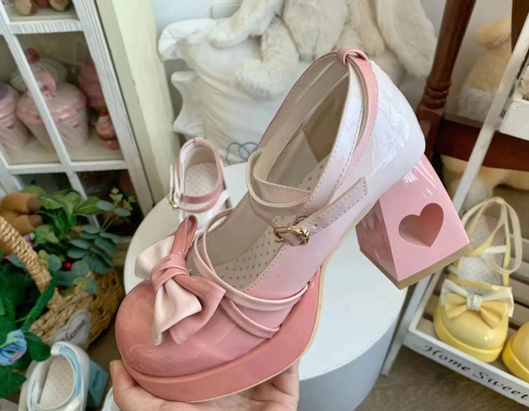Pink Sweet Lolita gradient platform heels featuring glossy patent leather upper, heart-shaped heel cutout, rounded platform toe, and cross ankle strap with delicate bow fastening