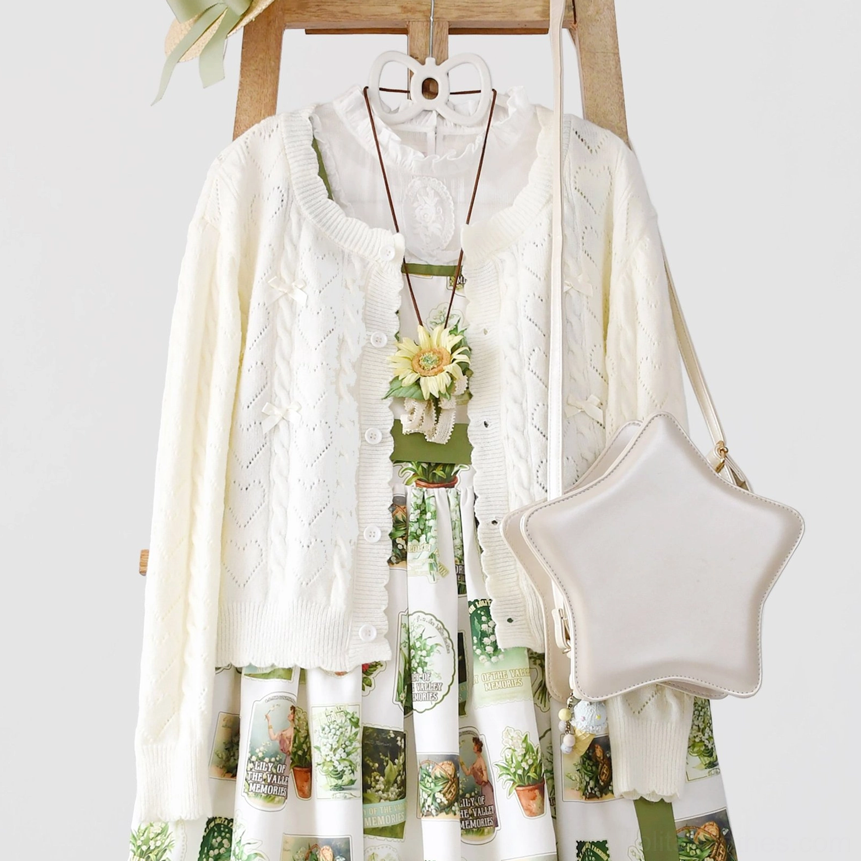 Pink hollow out long sleeve Lolita cardigan color variant showcasing sweet Lolita aesthetic, front full-length display