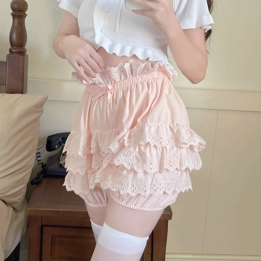 Pink Lolita lace bloomer shorts front medium shot with clear view of layered lace hem and gentle light pink color