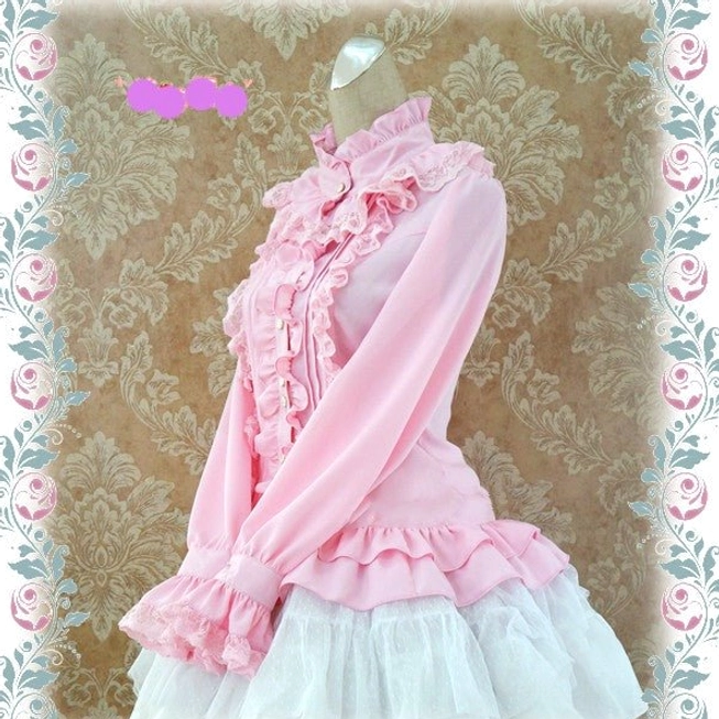 Pink silk Lolita stand collar blouse left side view showing fitted silhouette ruffled cuffs and lace trim details