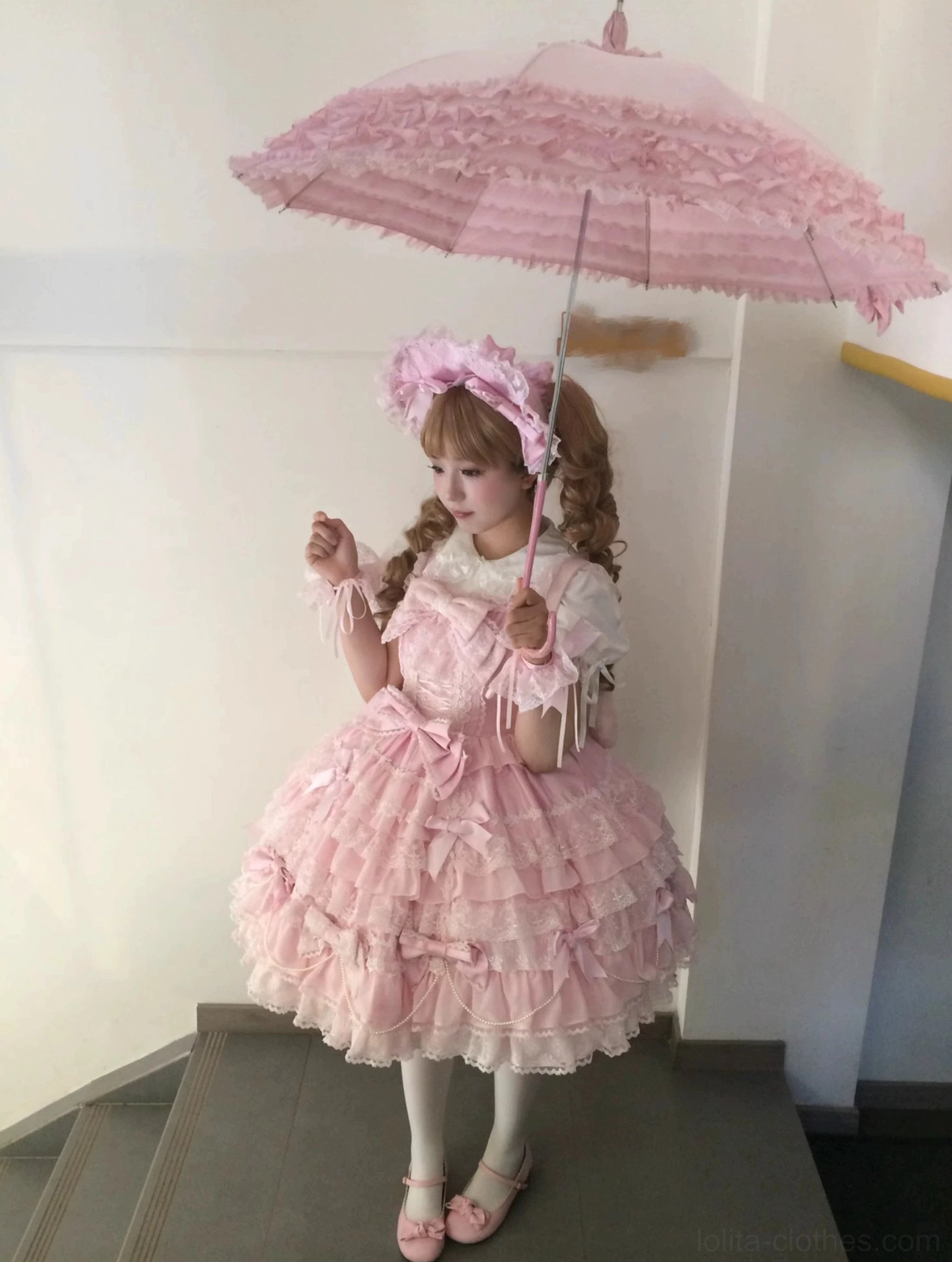 Pink lolita bonnet bonnete with decorative details overhead angle showcasing construction quality and sweet lolita aesthetic design