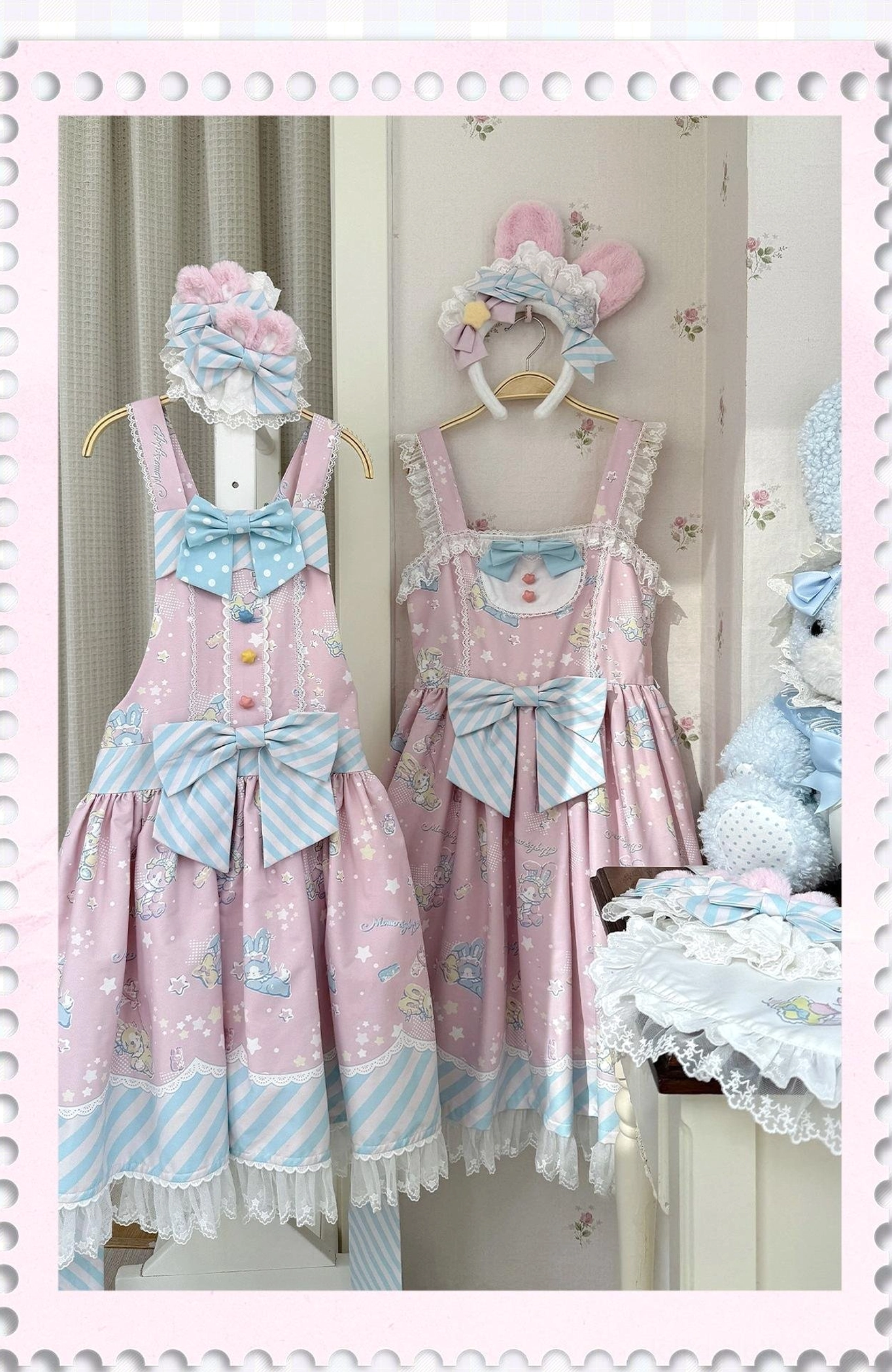 Front hanging display shot of pink Lolita jumper skirt with matching hair accessories, showcasing bowknot shoulder straps, ruffled lace hem, and bunny print fabric in framed cute indoor display space