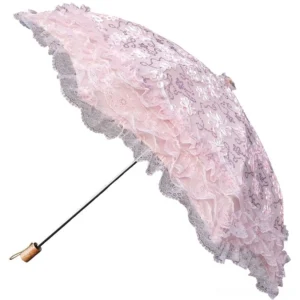 Pink lace Lolita parasol with floral embroidery and multi-layered ruffled edges displayed on white background, oblique side view showing full unfolded umbrella canopy