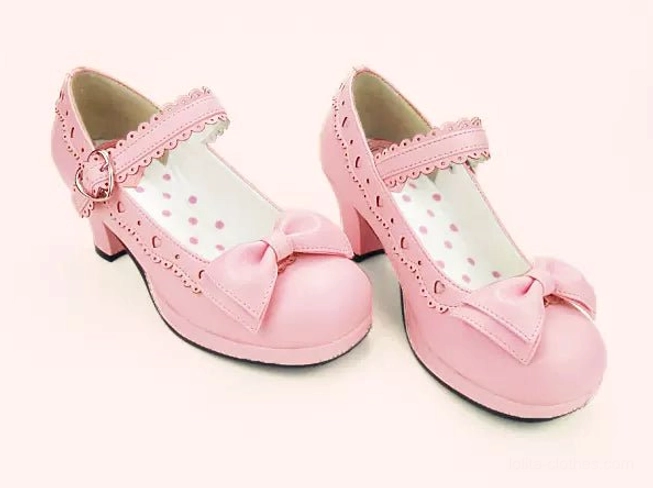 Pink lolita mary jane heel shoes three-quarter side profile view with heart buckle and scalloped trim