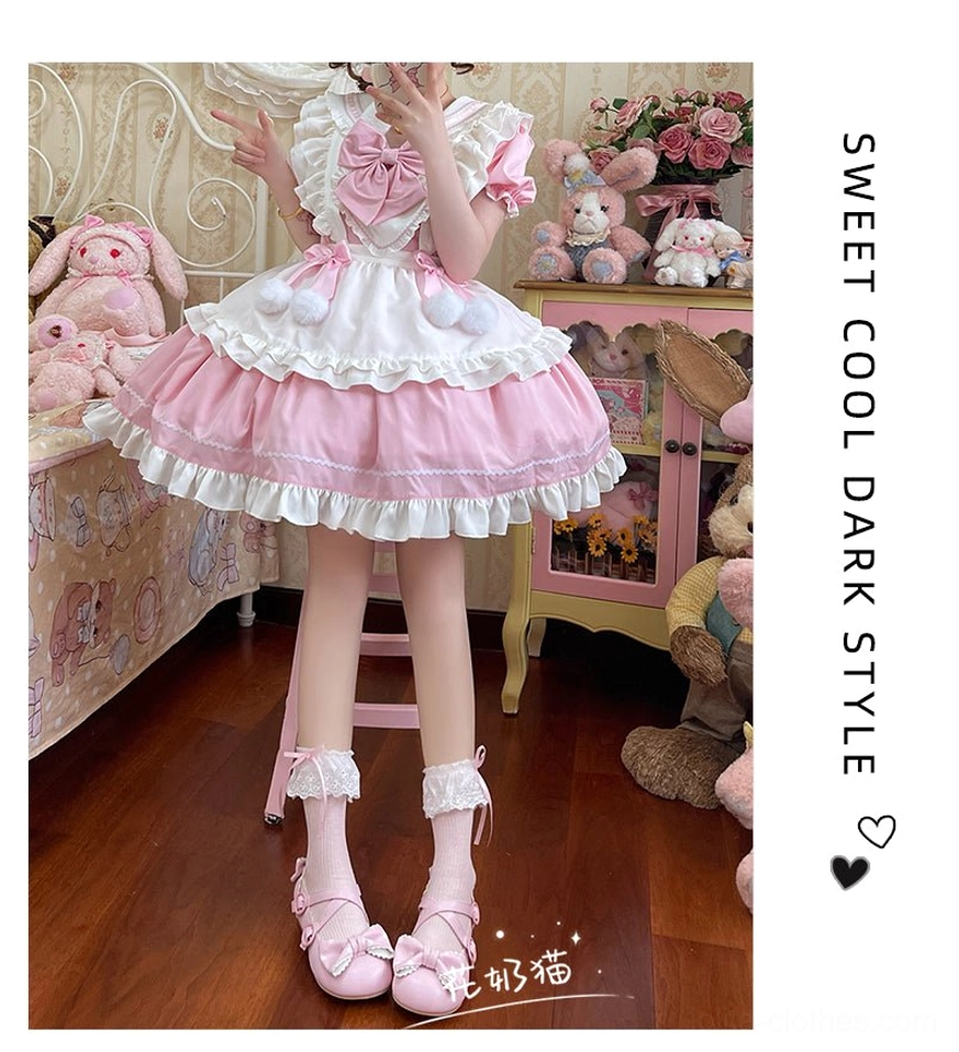 Pink mid-calf lolita socks with white lace ruffle and bow paired with pink and white maid lolita dress, full-length leg view low angle shot