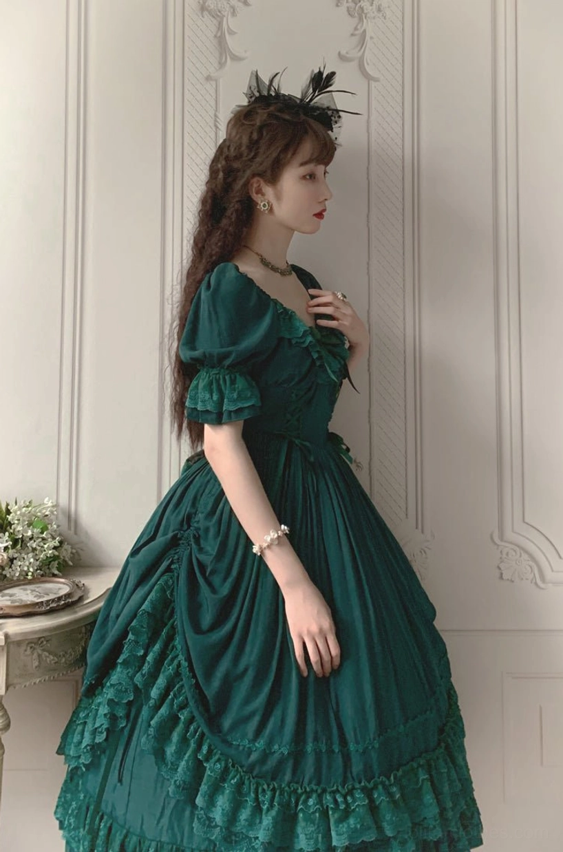 Pink French Lolita one-piece dress styled with cameo brooch and delicate jewelry for romantic aesthetic