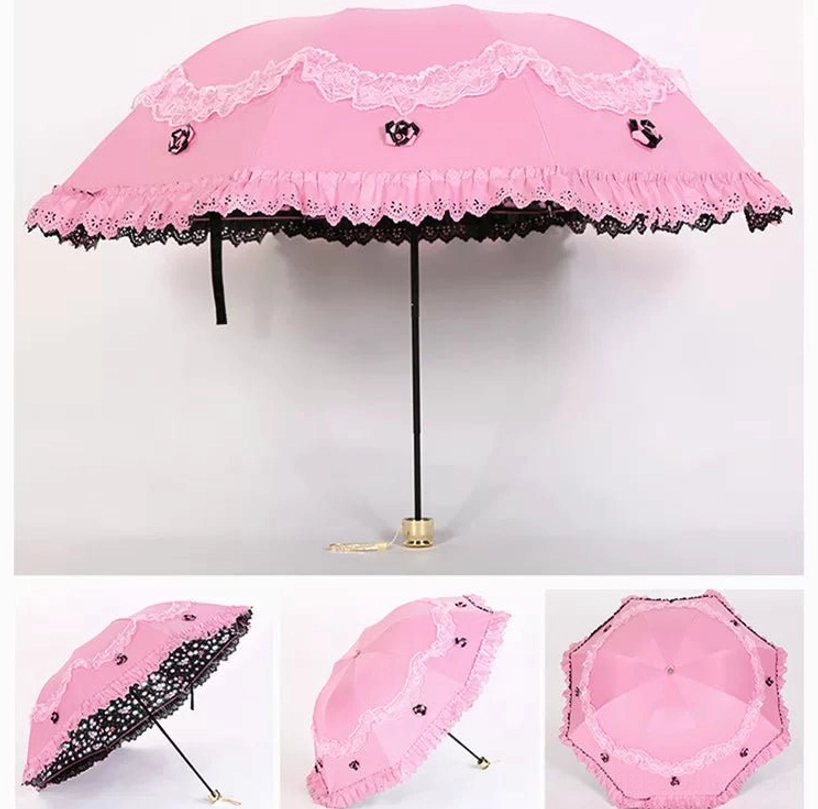 Pink foldable lolita parasol with delicate embroidered rose patterns and romantic scalloped lace border, metal frame and carrying strap