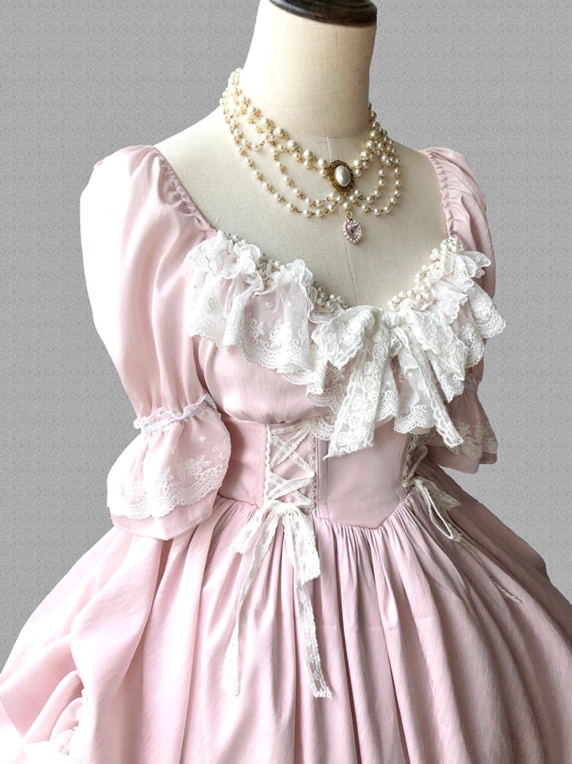 Pink French Lolita one-piece short dress showing playful proportions and sweet aesthetic styling