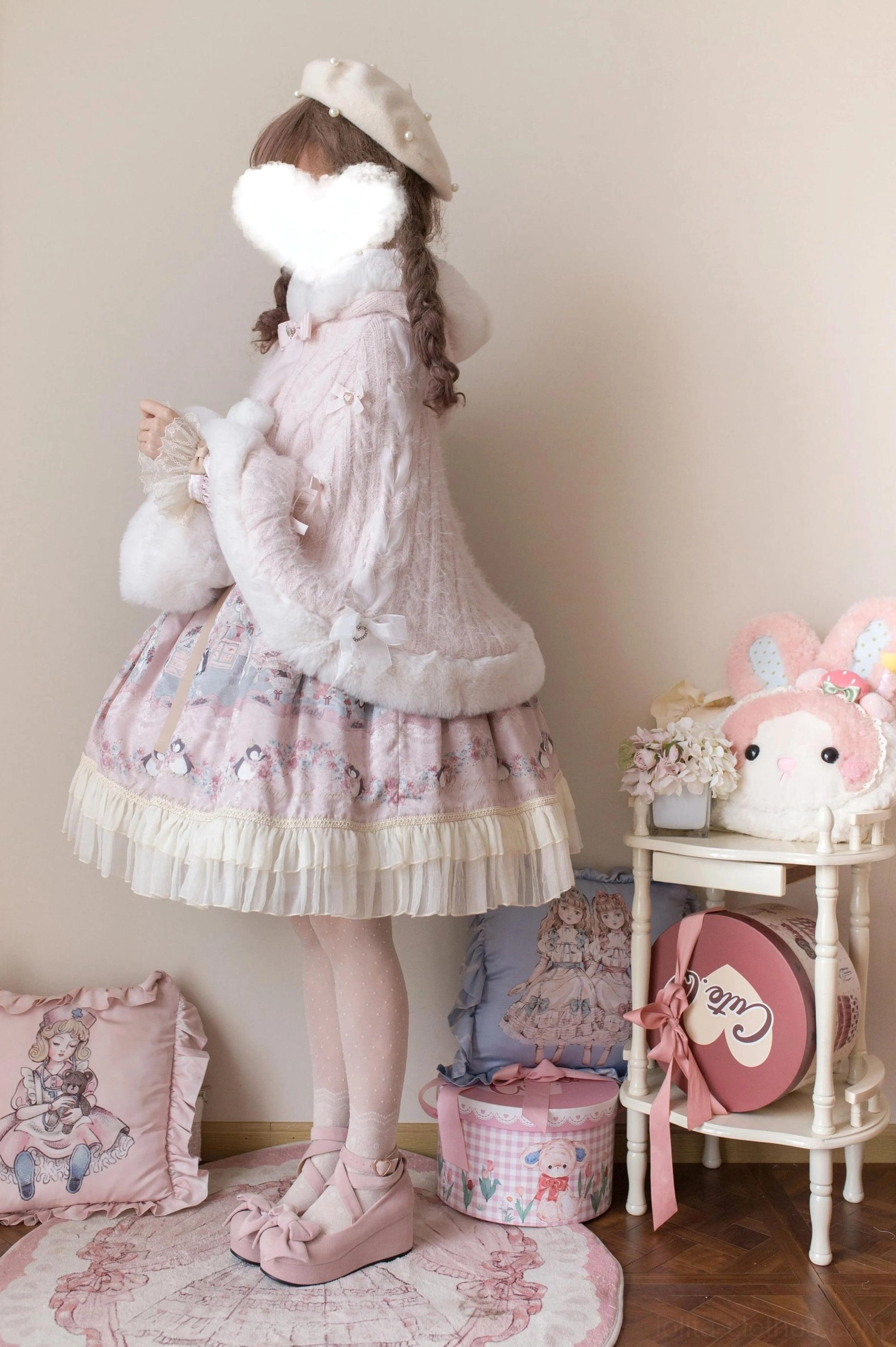 Pink faux fur short lolita winter coat full back standing view with solid plush fabric, stand collar, cropped slim silhouette, model wearing pink ruffled lolita skirt and beret