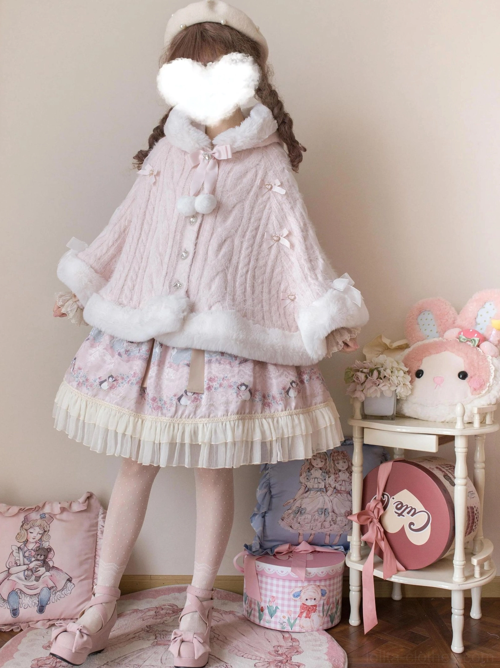Pink faux fur lolita winter cape coat with cable knit pattern, white plush trim, full back standing view paired with ruffled pink print lolita skirt