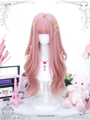 Pink long curly Lolita wig with straight blunt bangs styled full waves on mannequin, decorated with colorful hair clips and star clip, paired with gemstone necklace against pink aesthetic backdrop with vintage props
