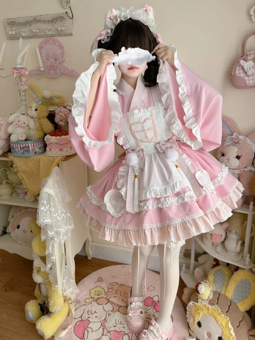 Pink maid lolita nurse dress set front standing view with face mask accessory pom-pom decorations frilled headpiece and white thigh-highs