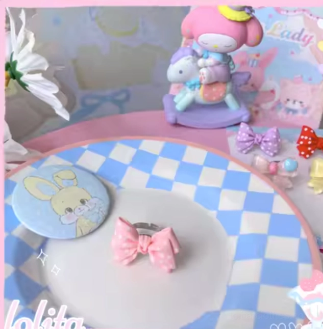 Pink pastel sweet lolita bowknot adjustable ring with heart embellishments perfect for classic sweet lolita coordinates and kawaii fashion enthusiasts