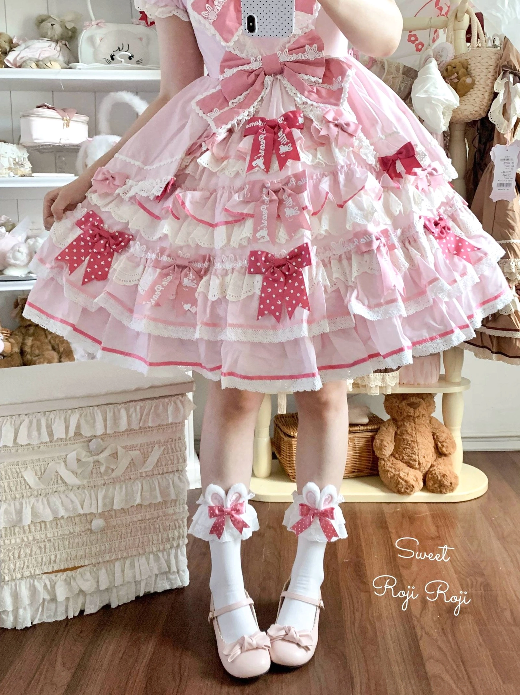 Pink polka dot themed lolita socks back view model wearing matching polka dot bow frilled lolita skirt pink shoes ankle trim