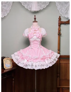Pink polka dot Old School Lolita halter OP dress front view on mannequin with layered ruffled skirt and vintage home studio background