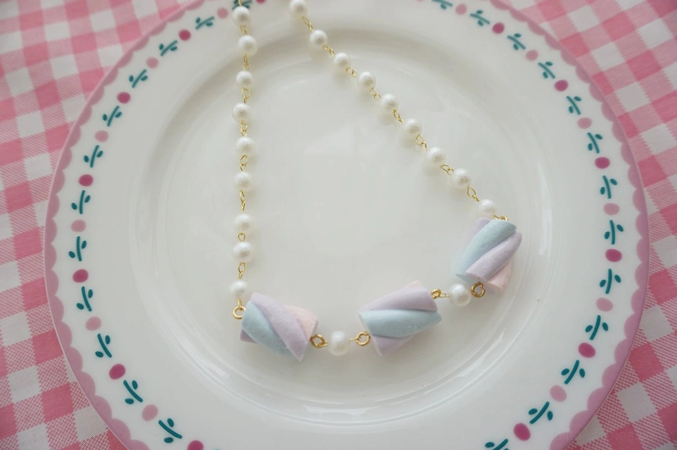 Pink and purple pastel cotton candy resin lolita bracelet variant featuring soft pink and lavender marshmallow charms, imitation pearls, gold-tone hardware, and adjustable metal extension clasp