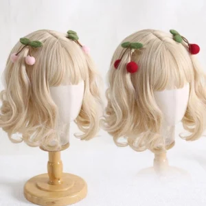 Pink and red cherry hair clips side-by-side comparison wool felt lolita accessories on wooden display stands