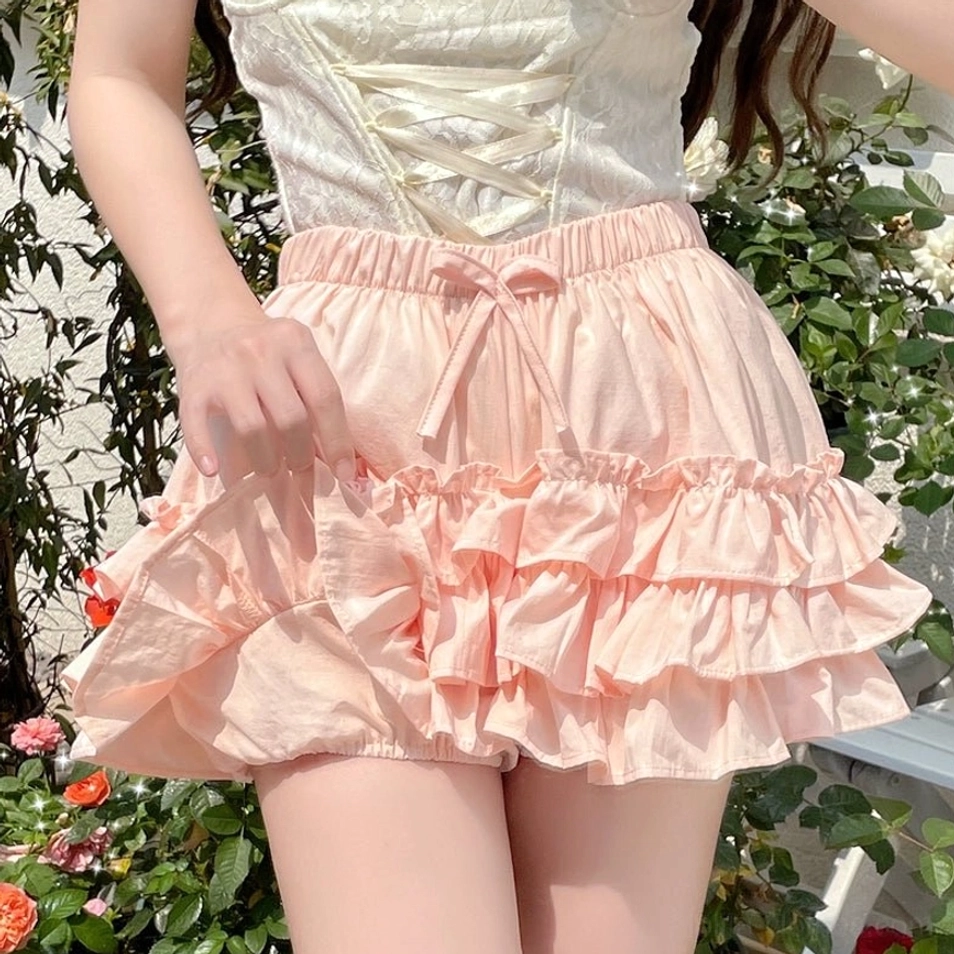 Pink ruffle bloomers flat lay display adjustable waist elastic drawstring bow decorative detail versatile lolita shorts foundation piece