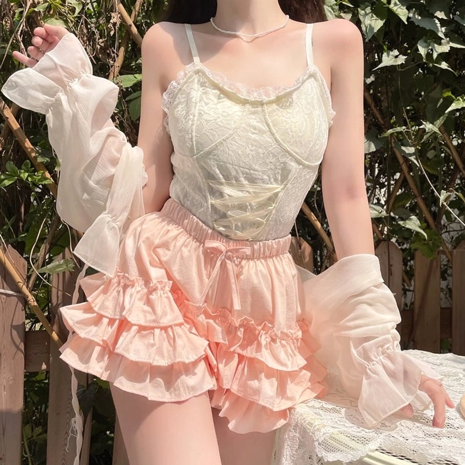 Pink ruffle safety bloomers ivory camisole sheer outerwear sitting pose garden table voluminous cute lolita silhouette coordinate