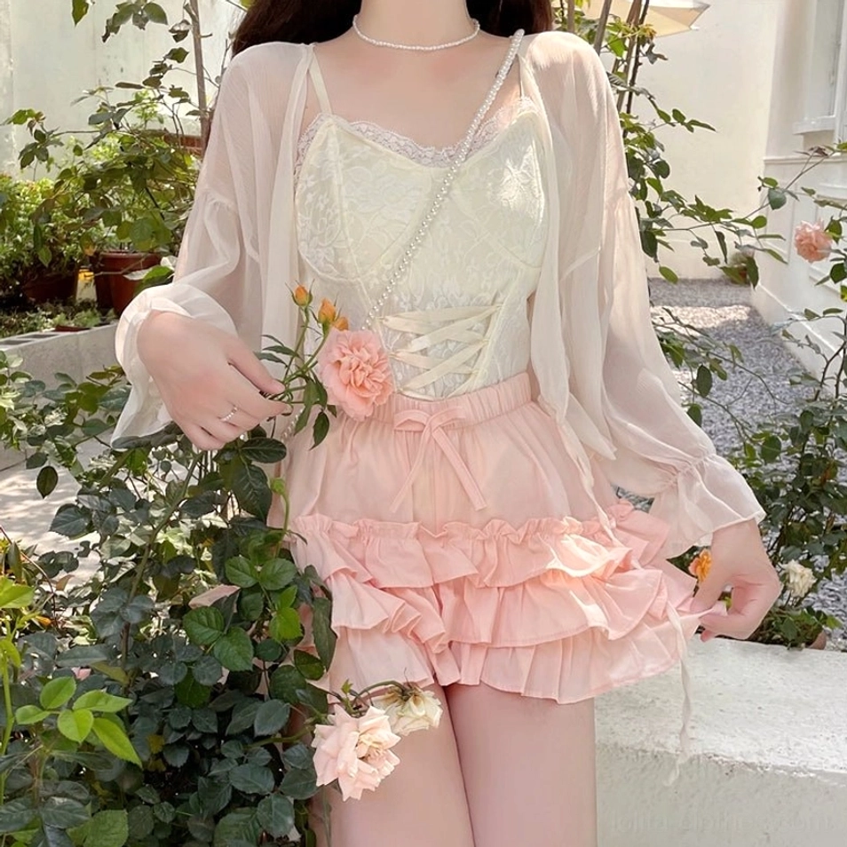 Pink ruffle bloomers ivory camisole sheer sun cardigan full lower body view holding roses garden outdoor outfit sweet lolita styling