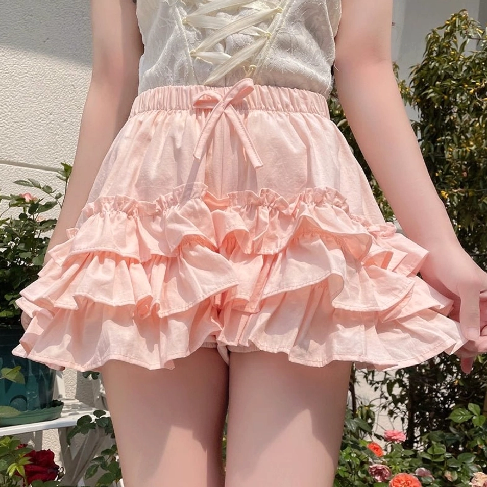 Close-up detail view pink ruffle bloomers waist thigh elasticated waist drawstring bow neat stitching finished seams quality craftsmanship