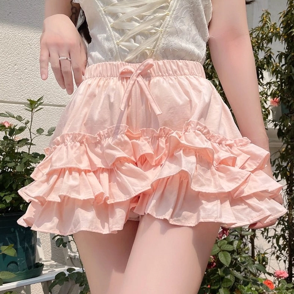 Pink ruffle safety bloomers side profile multi-layer ruffle hem cute bloomer silhouette pastel pink fabric swaying movement aesthetic