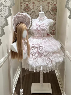Pink Sakura Blossom Dream Sweet Lolita accessory set featuring pink BNT bonnet with pearl chain trim and delicate lace ruffled trailing, coordinating pink choker necklace with faux pearl embellishments, full front display on mannequin with vintage floral wallpaper backdrop showing complete Sweet Lolita coordinate styling