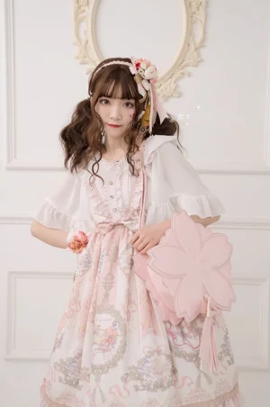 Pink sakura petal Lolita crossbody handbag with 3D flower petals and leather bow tassel worn by model in sweet lolita dress