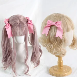 Pink satin bow hair clips styled on light purple and blonde curly wig mannequins demonstrating twin pigtail hairstyle for classic lolita fashion