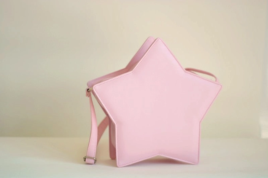 Pink star-shaped Lolita messenger bag three-quarter side angle view, showing neat stitching edges and adjustable shoulder strap detail on white background