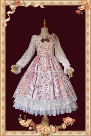 Pink strawberry gingham sweet Lolita JSK dress front view with patchwork floral prints, lace ruffled skirt hem, detachable chest bow, shown on mannequin in vintage ornate frame