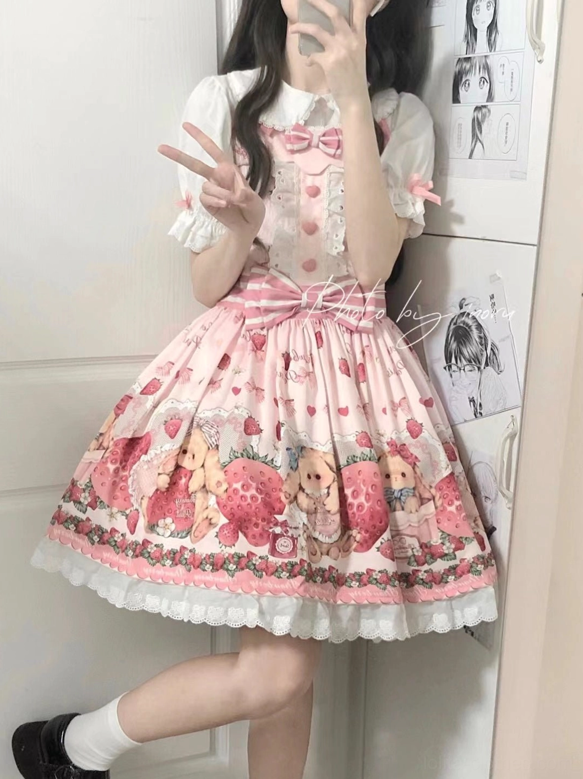 Pink strawberry sweet lolita salopette dress on model three-quarter view showing all design elements silhouette and proportions