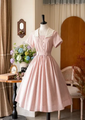 Front full-body display of pink vertical striped summer Lolita one-piece dress with ruffled white sailor collar and flared midi skirt on mannequin in vintage studio