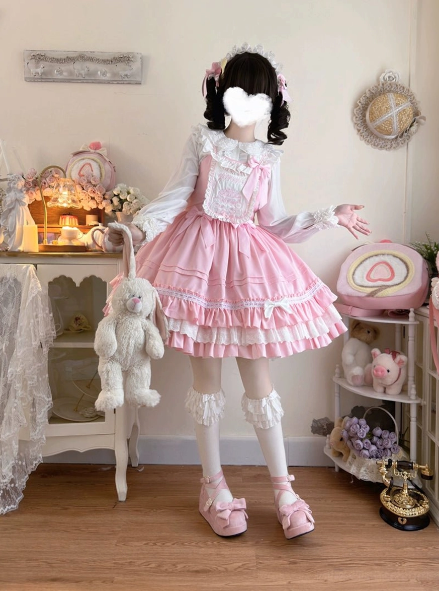 Pink sweet bear embroidered Lolita JSK dress front view full body wearing white frilly socks and pink platform loafers cozy bedroom setting