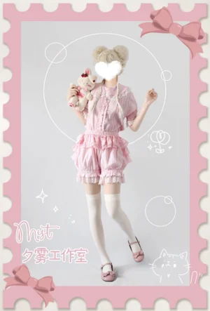 Pink lolita bloomer outfit coordinate set with full-body styling featuring twin buns hairstyle, white thigh-high socks, pink Mary Jane shoes, and cute stamp-themed border design elements