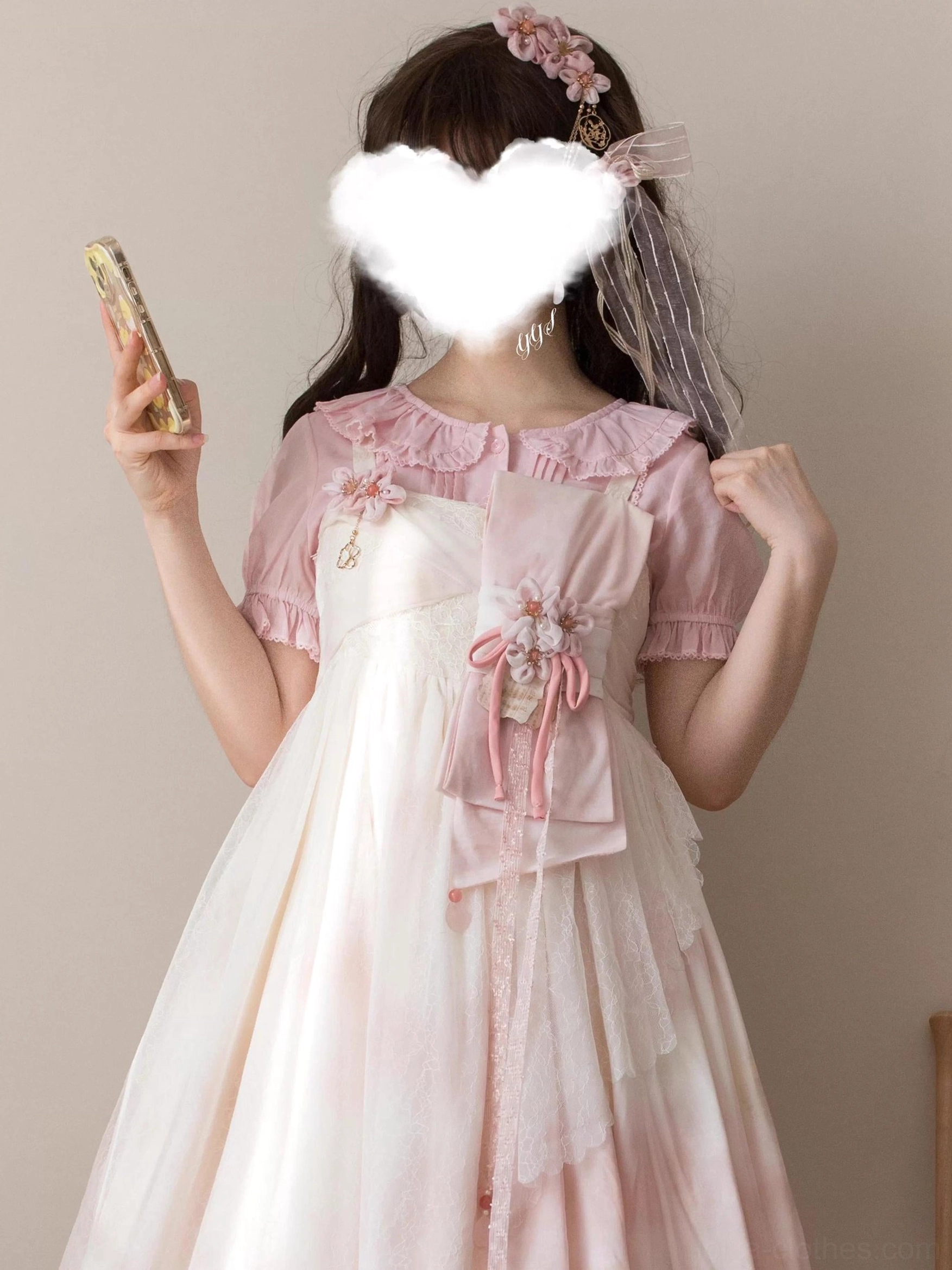 Pink sweet Lolita short-sleeve blouse back three-quarter view with floral hair accessories, featuring ruffled Peter Pan collar, short puff sleeves, and decorative floral brooch